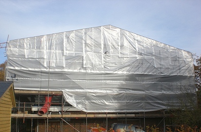 A sheeted beamed independent scaffold for a temporary roof at Roxwell, Chelmsford.