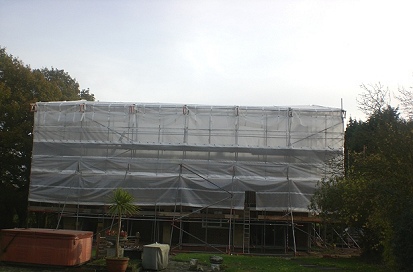 A sheeted beamed independent scaffold for a temporary roof at Roxwell, Chelmsford.